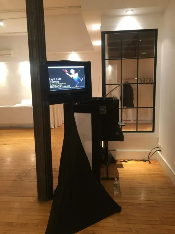 view of tv on stand for DJ Dieter's karaoke holiday gig