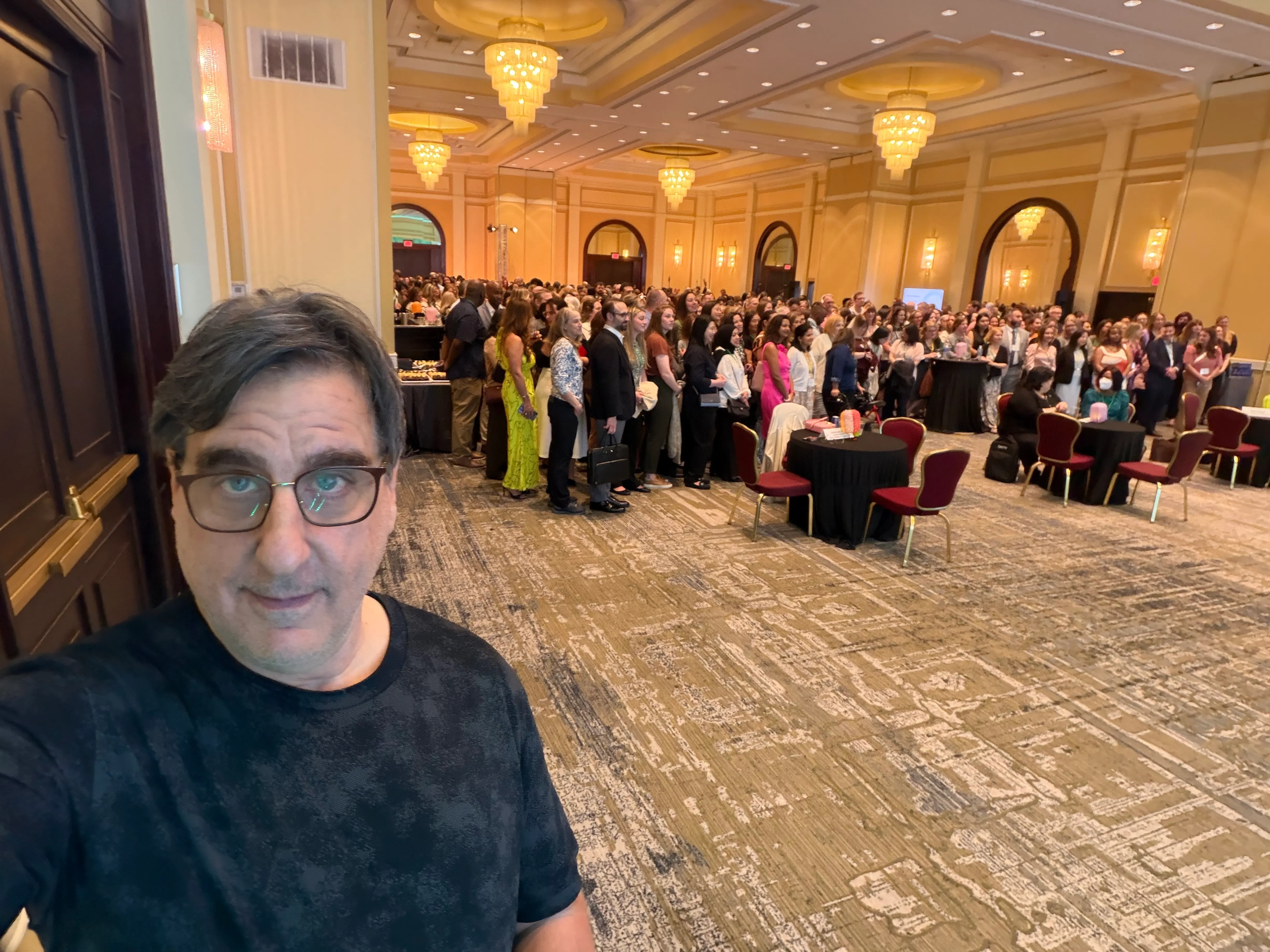 David Swirsky at a packed karaoke event in an NYC ballroom